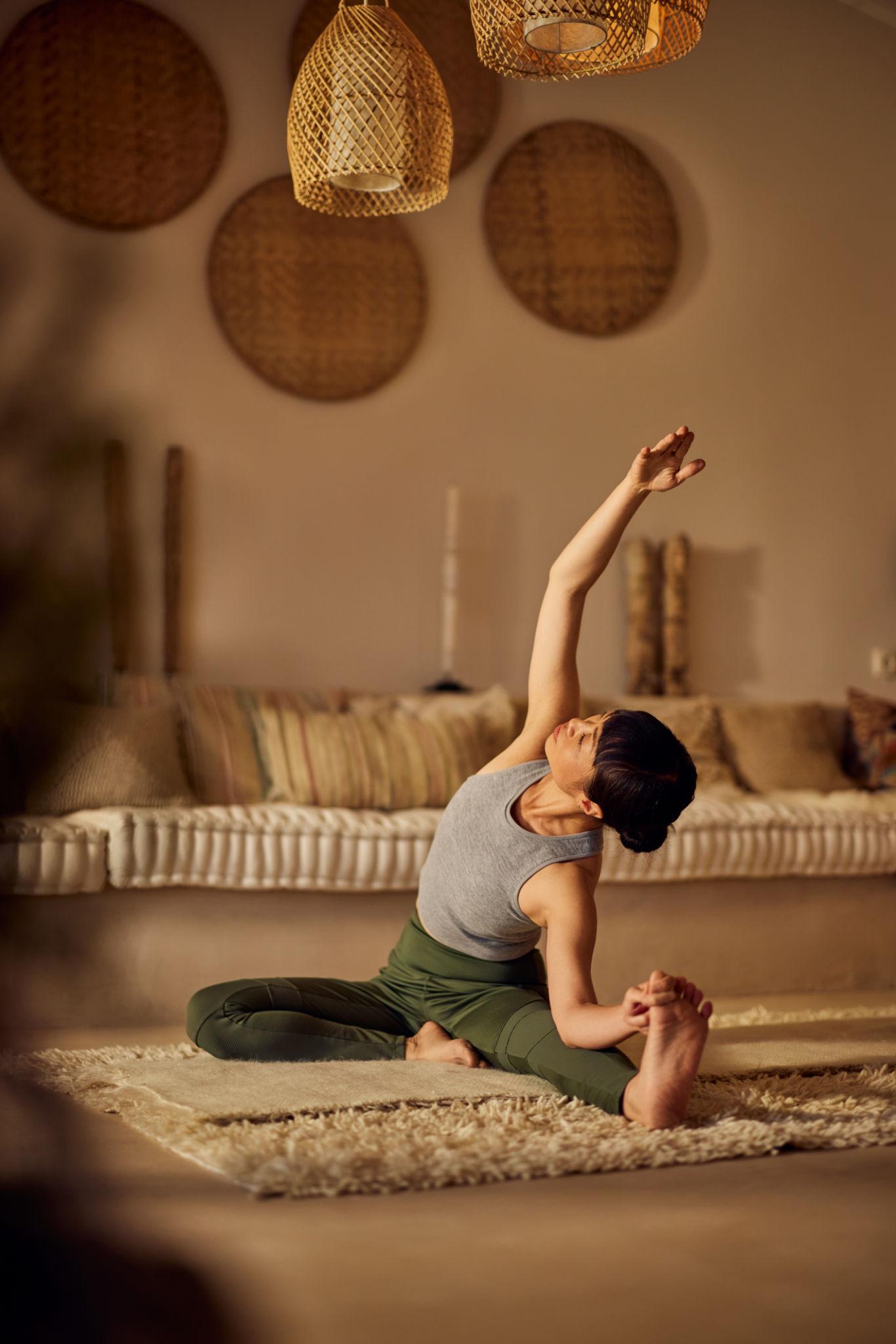 Sneha Bhatt — Certified Yoga & Pilates Instructor with student